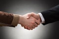 Worker and businessman shaking hand Royalty Free Stock Photo