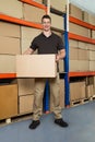 Worker With Cardboard Box In Warehouse Royalty Free Stock Photo