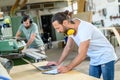 Worker in a carpenters workshop with computer Royalty Free Stock Photo