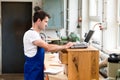 Worker in a carpenter's workshop with computer Royalty Free Stock Photo