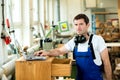 Worker in a carpenter's workshop with computer Royalty Free Stock Photo