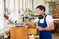 Worker in a carpenter's workshop with computer Royalty Free Stock Photo