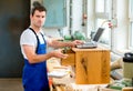 Worker in a carpenter's workshop with computer Royalty Free Stock Photo
