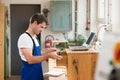 Worker in a carpenter's workshop with computer Royalty Free Stock Photo