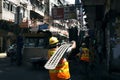 An worker carries a iron plate