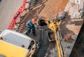 Worker carries out cleaning, repair and maintenance of outdoor street sewers