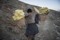 Worker carries sulfur inside Ijen crater in Ijen Volcano, Indonesia.