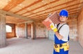 Worker carry brick on construction site