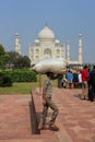 Worker carrying bag on his head at Taj Mahal complex, Agra, Uttar Pradesh, India