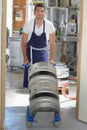 Worker carrying barrel with beer at brewery Royalty Free Stock Photo