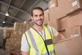 Worker carrying box in warehouse Royalty Free Stock Photo