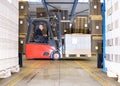 Worker Carrying Goods On Forklift