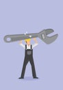 Worker Carrying Huge Adjustable Wrench Spanner Royalty Free Stock Photo