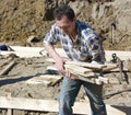 Worker carrying planks