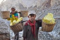 Worker carrying sulfur inside Kawah Ijen crater. Indonesia