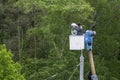 Worker changes a lamp in a street lamp