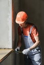 Worker is checking the correctness of the installation of a wind Royalty Free Stock Photo