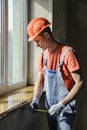 Worker is checking the correctness of the installation of a wind