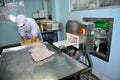 A worker is checking for hidden metal in finished products in a seafood factory in Ho Chi Minh city