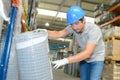 Worker checking reference on roll fencing