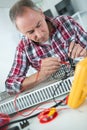 Worker checking tool with optical device Royalty Free Stock Photo