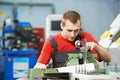 Worker checking tool with optical device Royalty Free Stock Photo