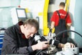 Worker checking tool with optical device Royalty Free Stock Photo