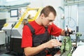 Worker checking tool with optical device Royalty Free Stock Photo