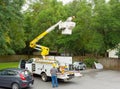 A worker in a cherry picker