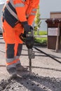 Worker with chisel hammer - close-up