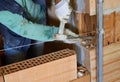 Worker with chisel on an internal wall