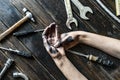 Worker class person dirty dark hands on the wooden table with tools equipment f