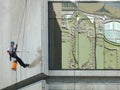 Worker clean the building wall