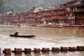Worker clean up the river in Fenghuang ancient city.
