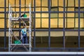 Worker clean a window at the business center