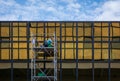 Worker clean a window at the business center