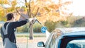 Worker cleaning car with high pressure water nozzle Royalty Free Stock Photo