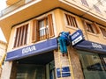 Worker cleaning the facade of the Spanish BBVA