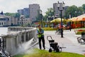 The worker is cleaning fence with high pressure water cleaner