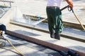 Worker cleaning floor with high pressure water jet Royalty Free Stock Photo