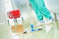 Worker cleaning floor with machine Royalty Free Stock Photo