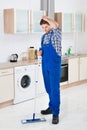 Worker Cleaning Floor With Mop Royalty Free Stock Photo