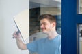 Worker Cleaning Glass With Squeegee Royalty Free Stock Photo