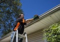 Worker Cleaning Gutters Royalty Free Stock Photo