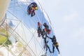 Worker cleaning high tower