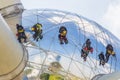 Worker cleaning high tower