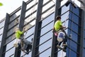 Worker cleaning high tower