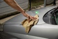 Worker cleaning silver car closeup. Car detailing series Royalty Free Stock Photo