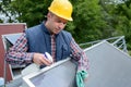 worker cleaning solar panel with spray product Royalty Free Stock Photo