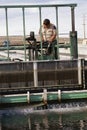 Worker cleaning water Royalty Free Stock Photo